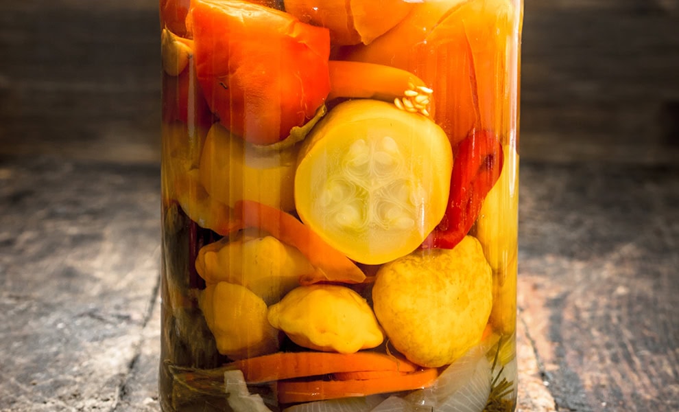 a jar of tomatoes and veg stock image