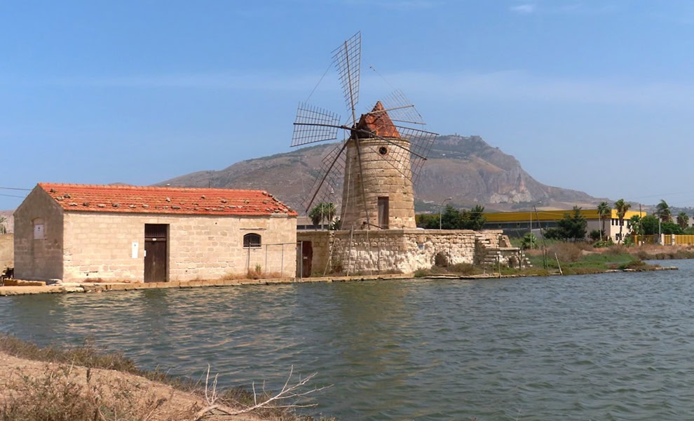 A windmill called Mulino Maria Stella once used to lift water to the salt marshes Western Sicily Italy by David Stanley