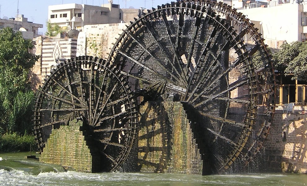 Hama, Syria - a view of 3 norias in front of the Azem palace by Heretiq